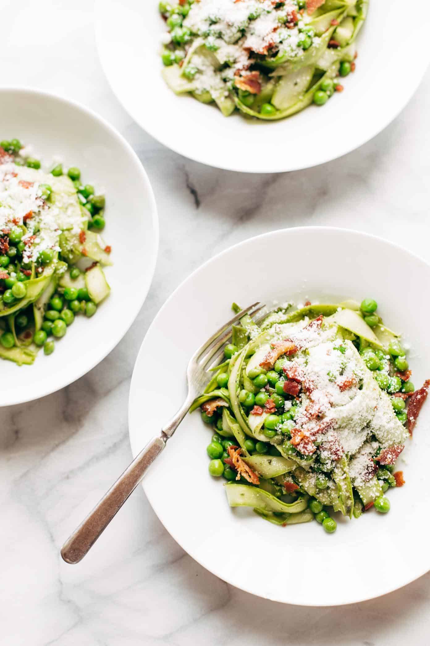 Asparagus Noodles with Pesto in bowls with forks.