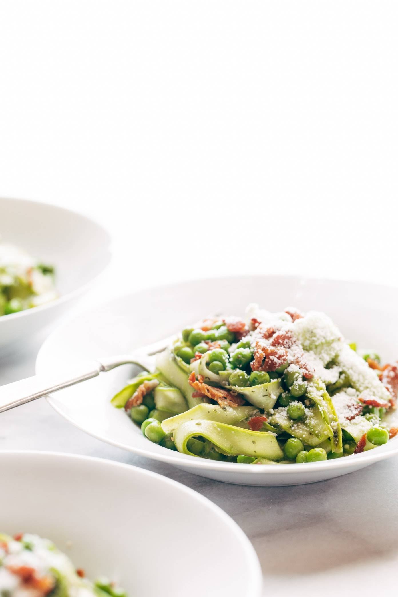 Asparagus Noodles with Pesto in a bowl with a fork.