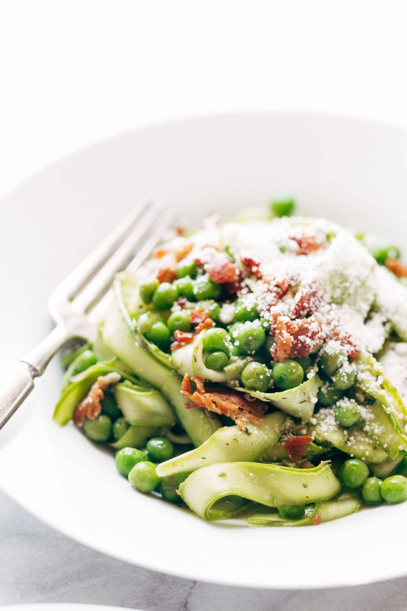 Asparagus Noodles with Pesto in a bowl with a fork.