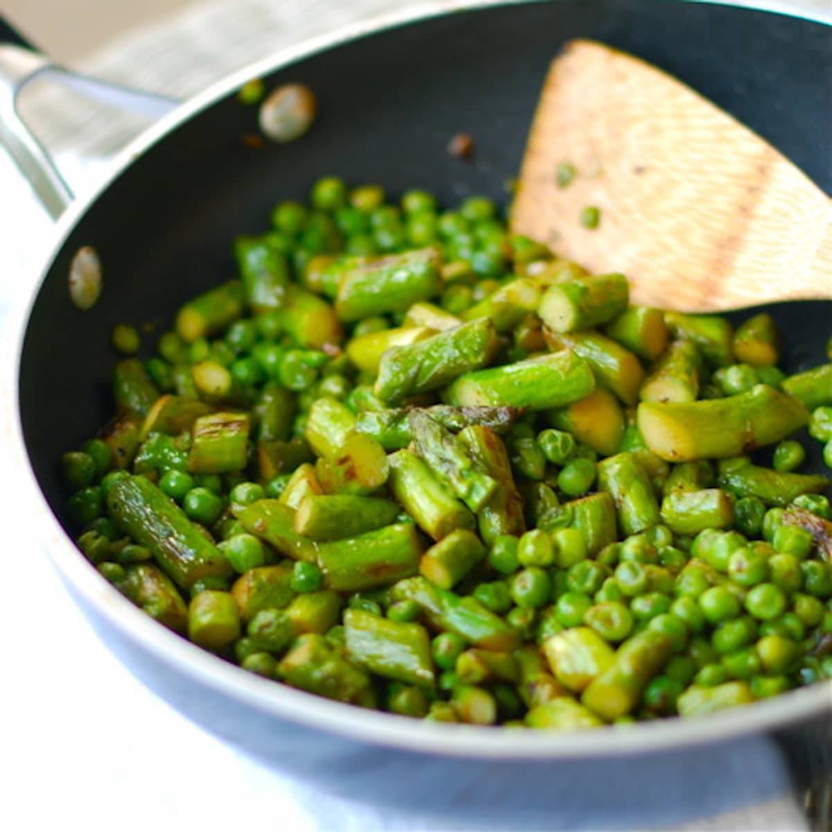 Butter, shallots and honey with asparagus and pea saute. 