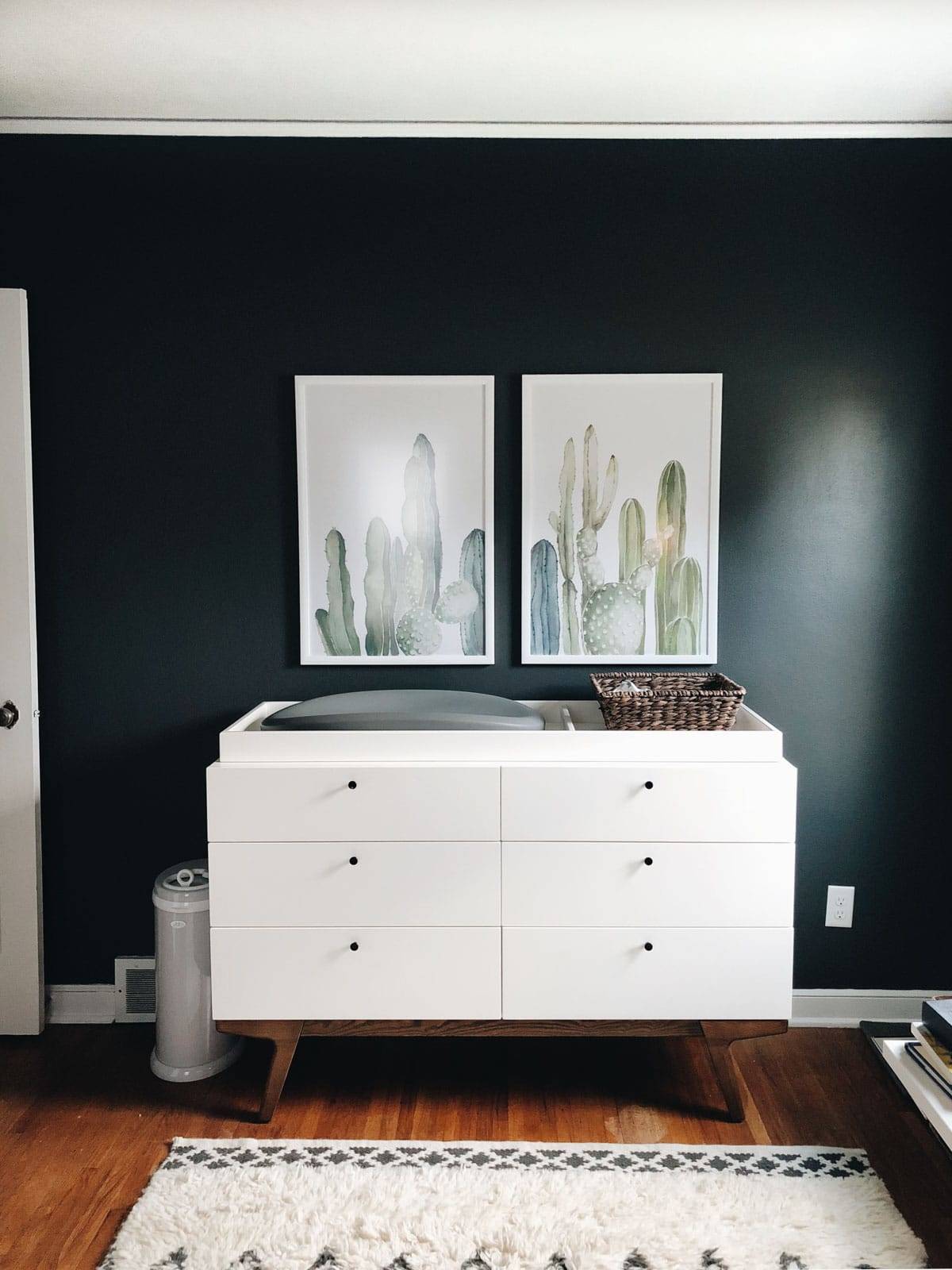 Modern changing table with decor.