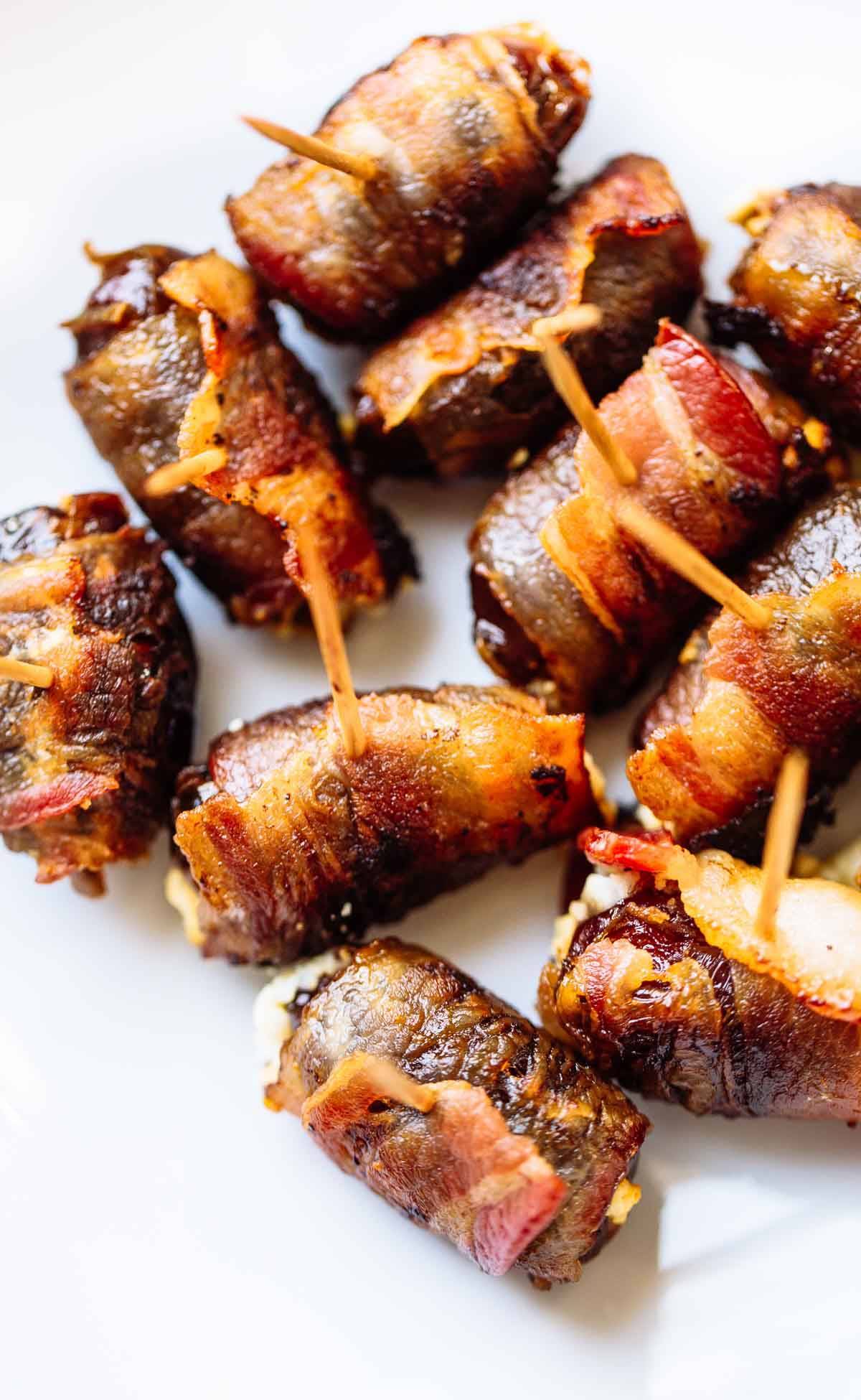Bacon Wrapped Dates with Goat Cheese on toothpicks.