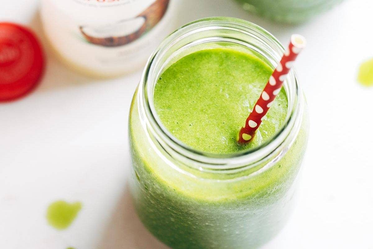 Simple Coconut Green Smoothie with a straw.
