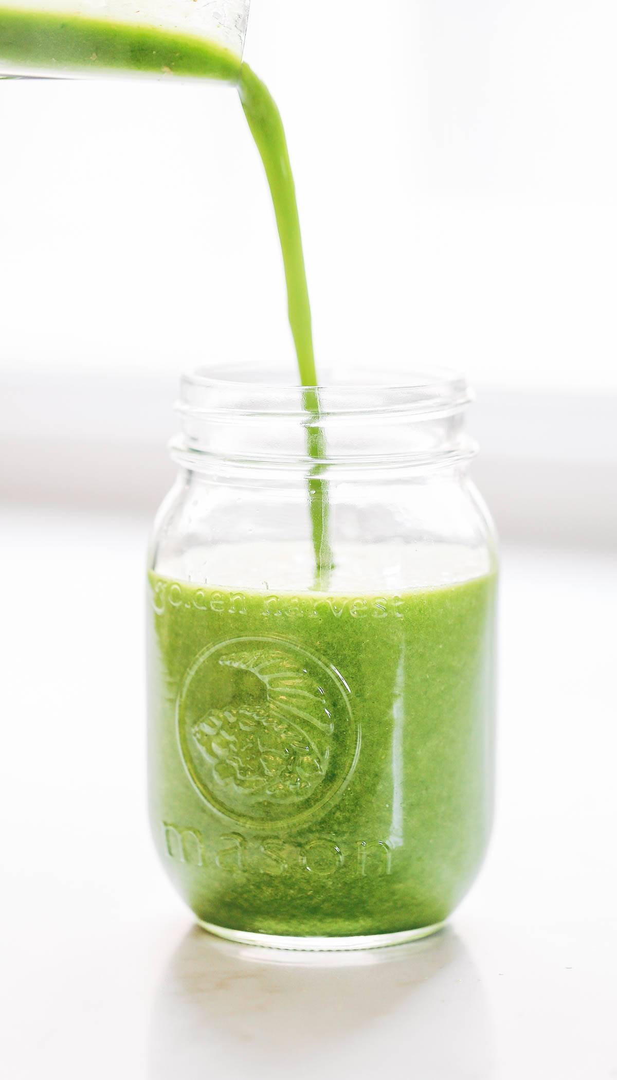 Coconut Green Smoothie pouring into a jar.