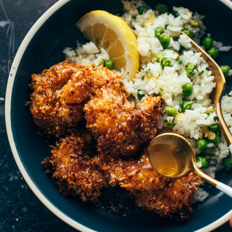 Coconut shrimp in a bowl with rice and peas