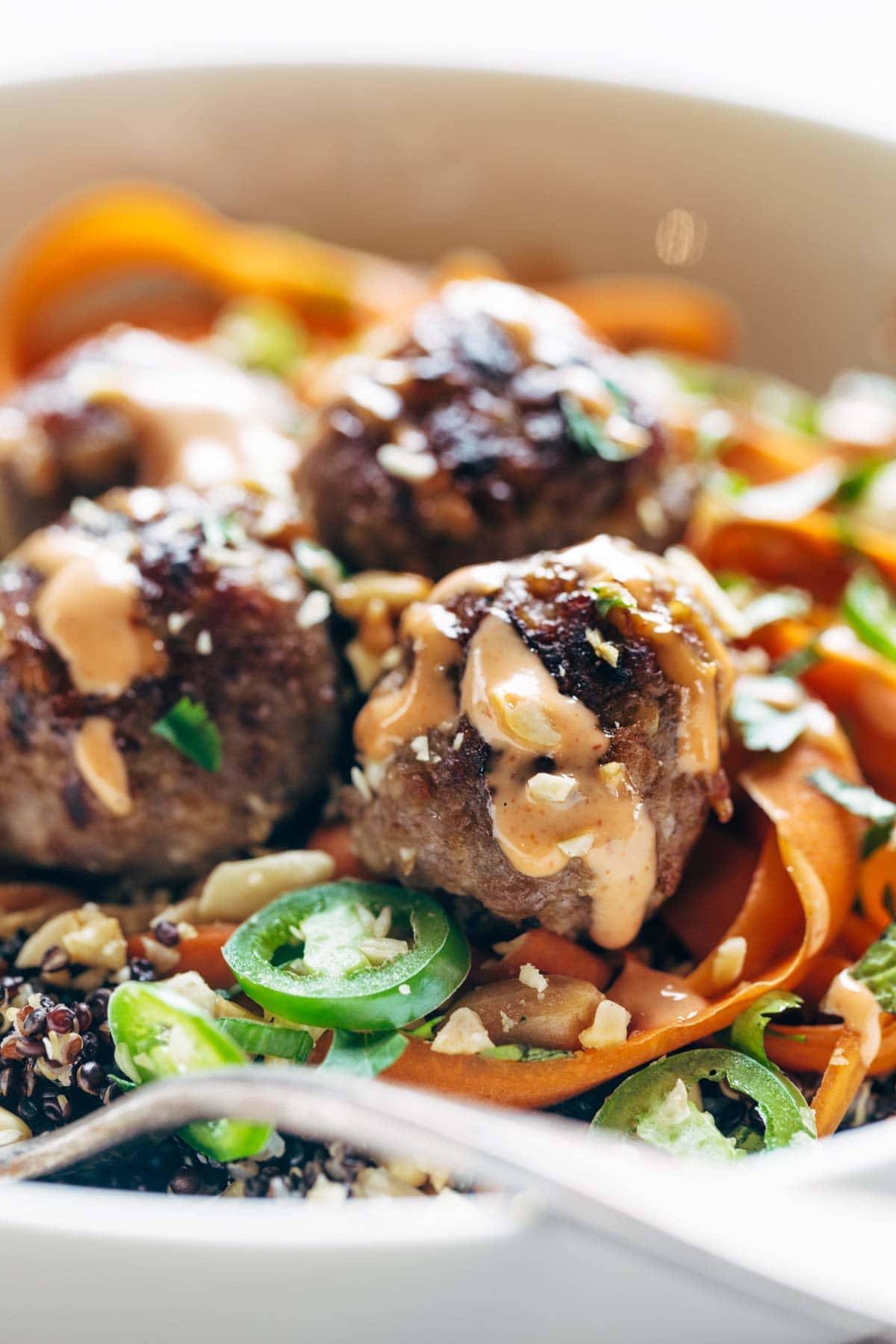 Close up of a banh mi bowl with meatballs.