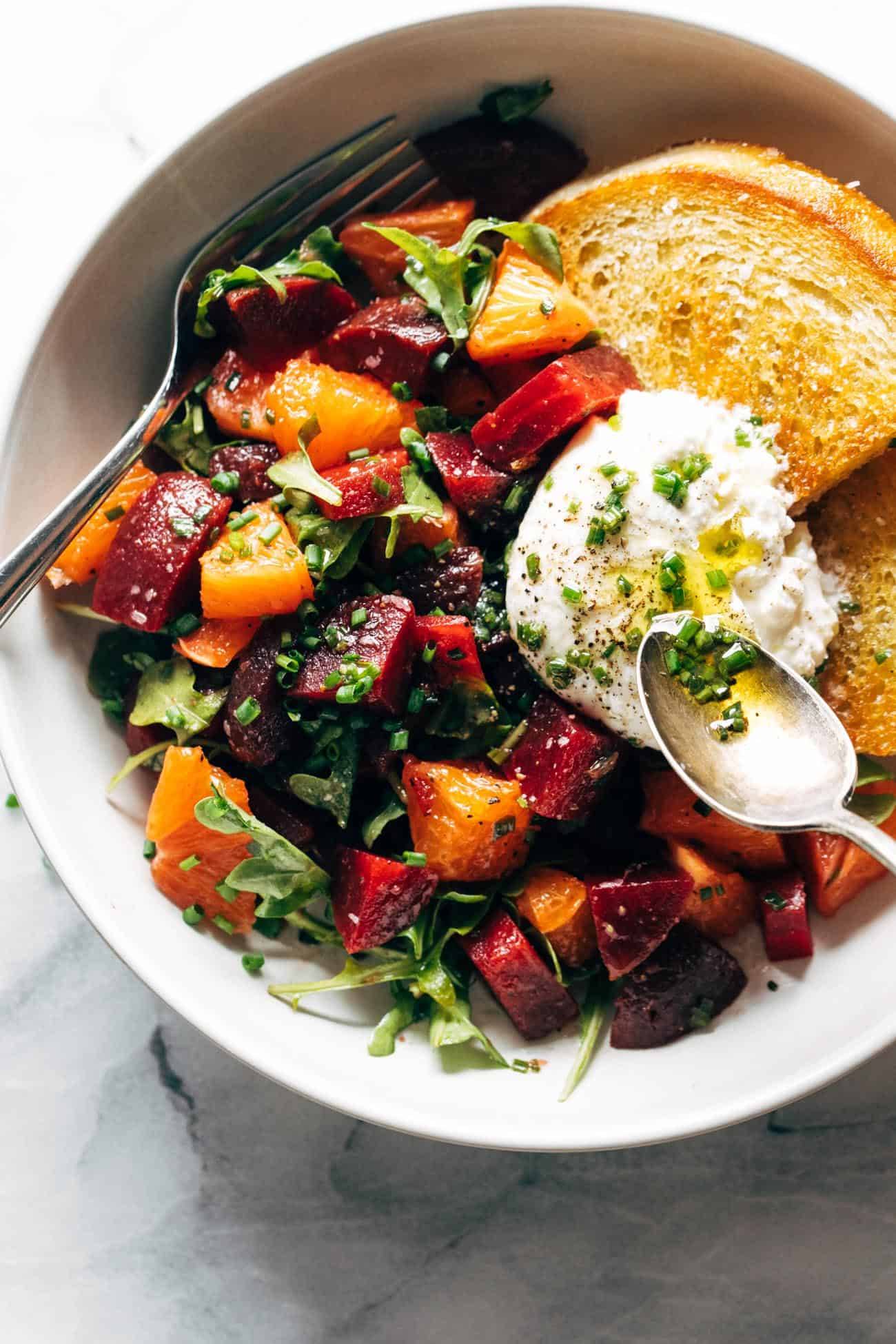 Beet and burrata salad in a bowl with fried bread