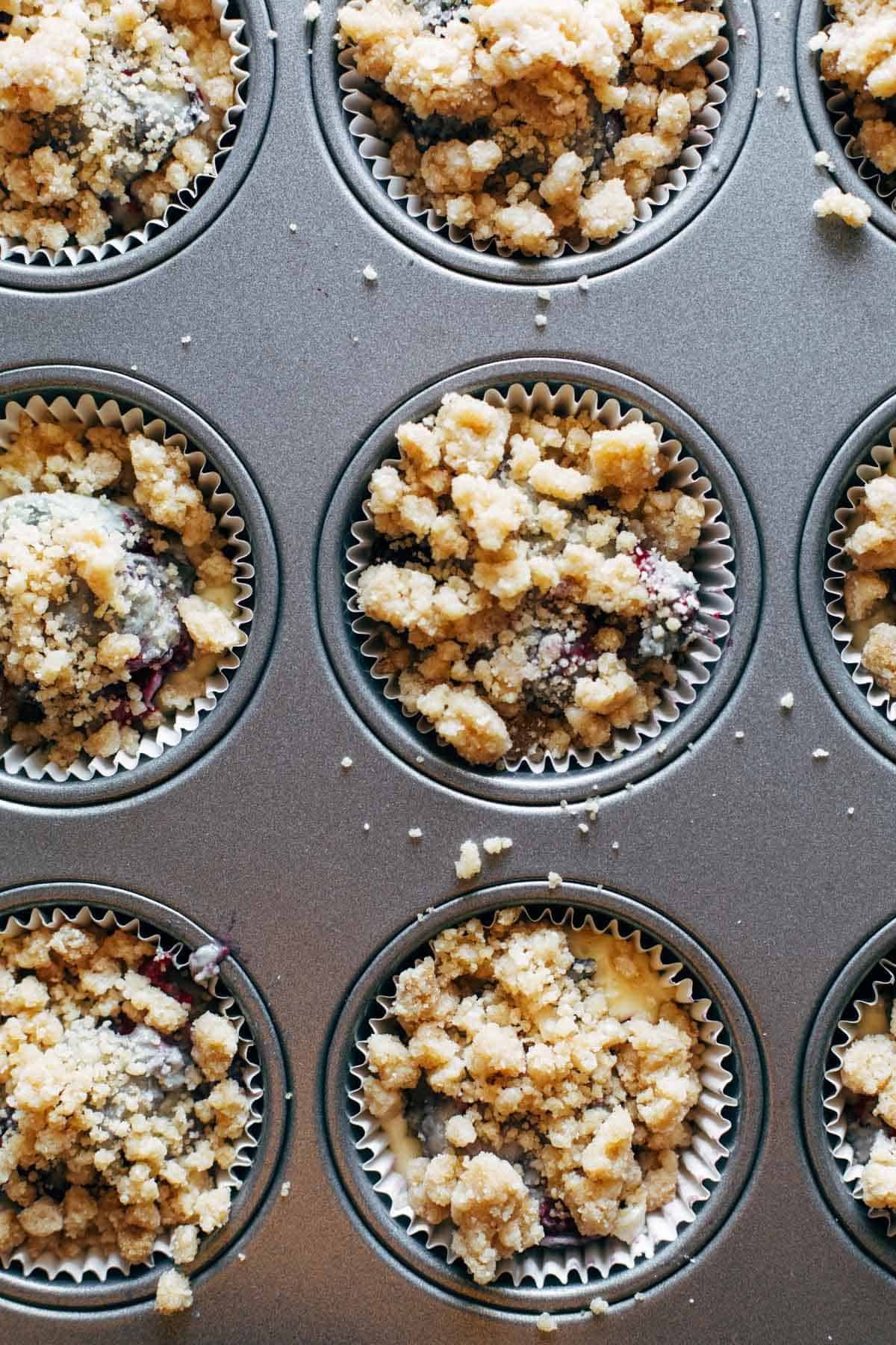 Berry cheesecake muffins in pan before baking.
