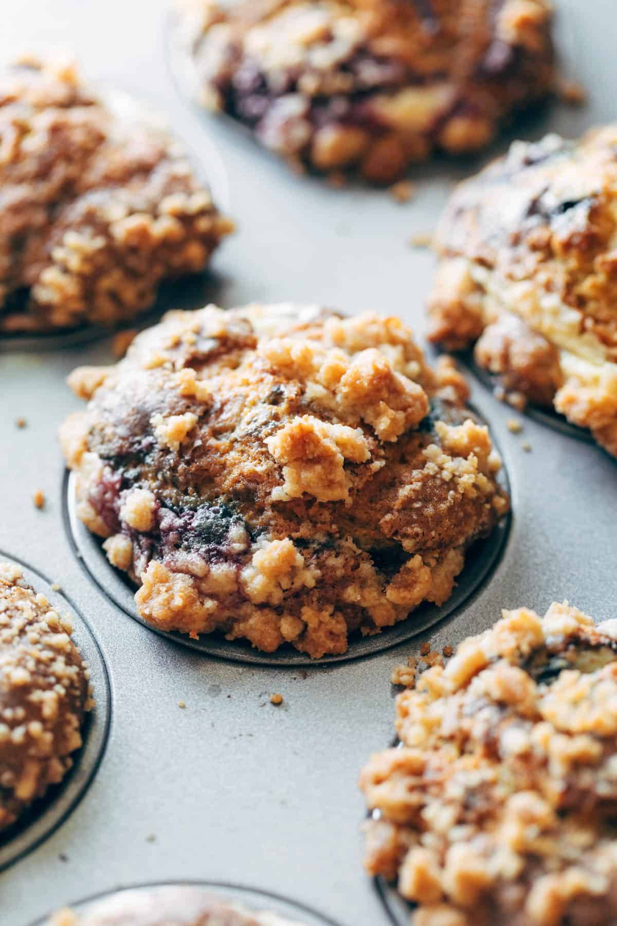 Berry cheesecake muffins in a pan.