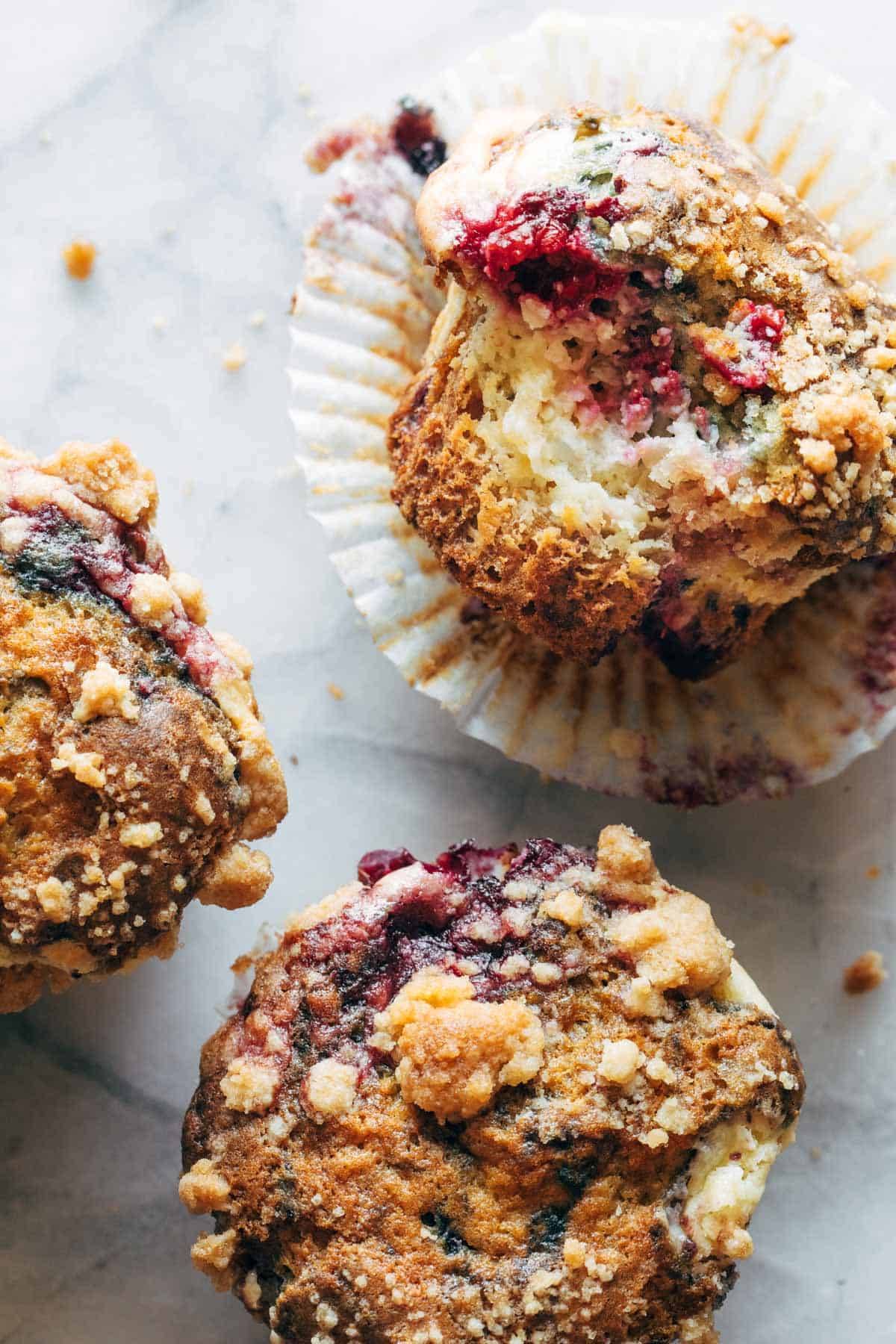 Berry cheesecake muffins in liners.