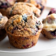 Mixed berry muffins on a plate.