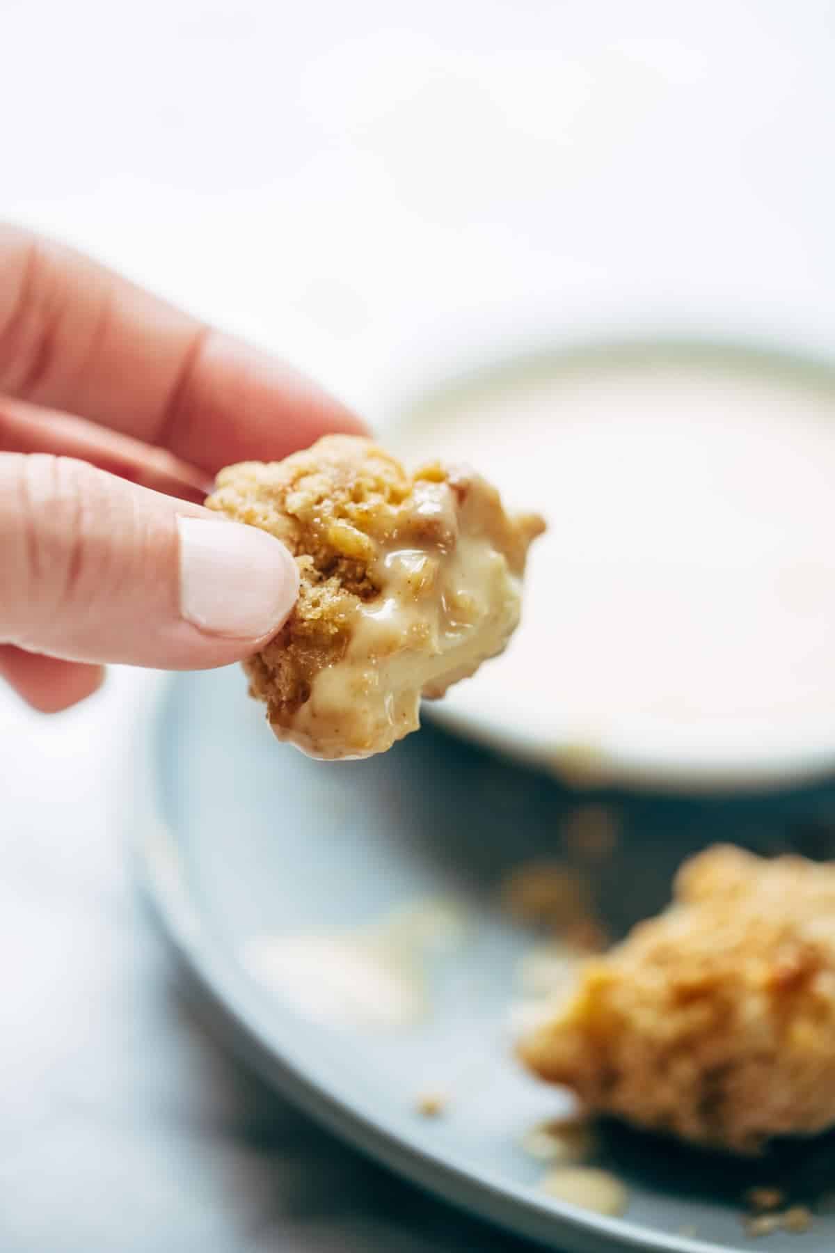 Everyone LOVES these! Baked popcorn chicken that tastes fried! Easy recipe, ready in 30 minutes. SO yummy and fun to share! | pinchofyum.com