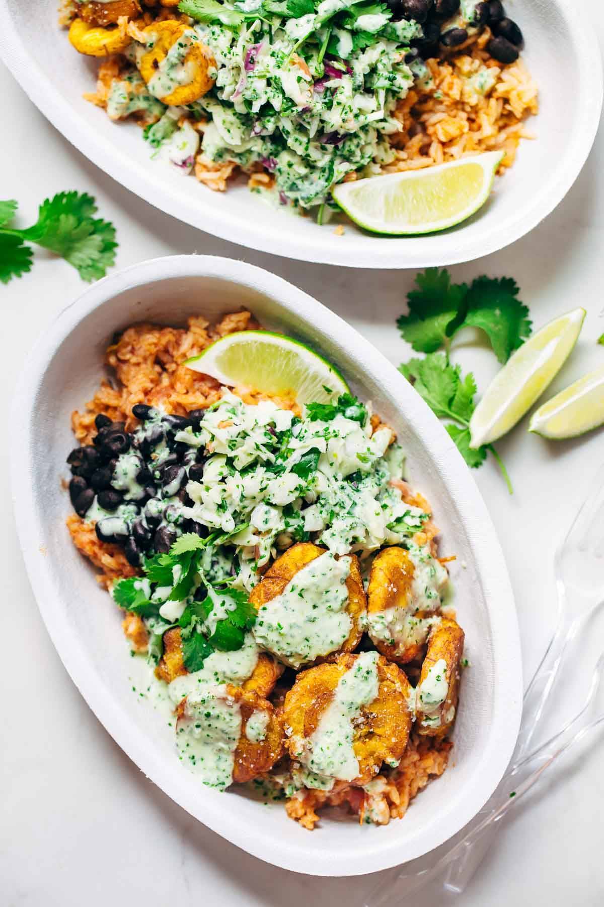 Spicy Brazilian Burrito Bowls recipe featuring seasoned rice and beans, garlic cilantro lime slaw, and crispy fried plantains. So good // almost vegan. | pinchofyum.com