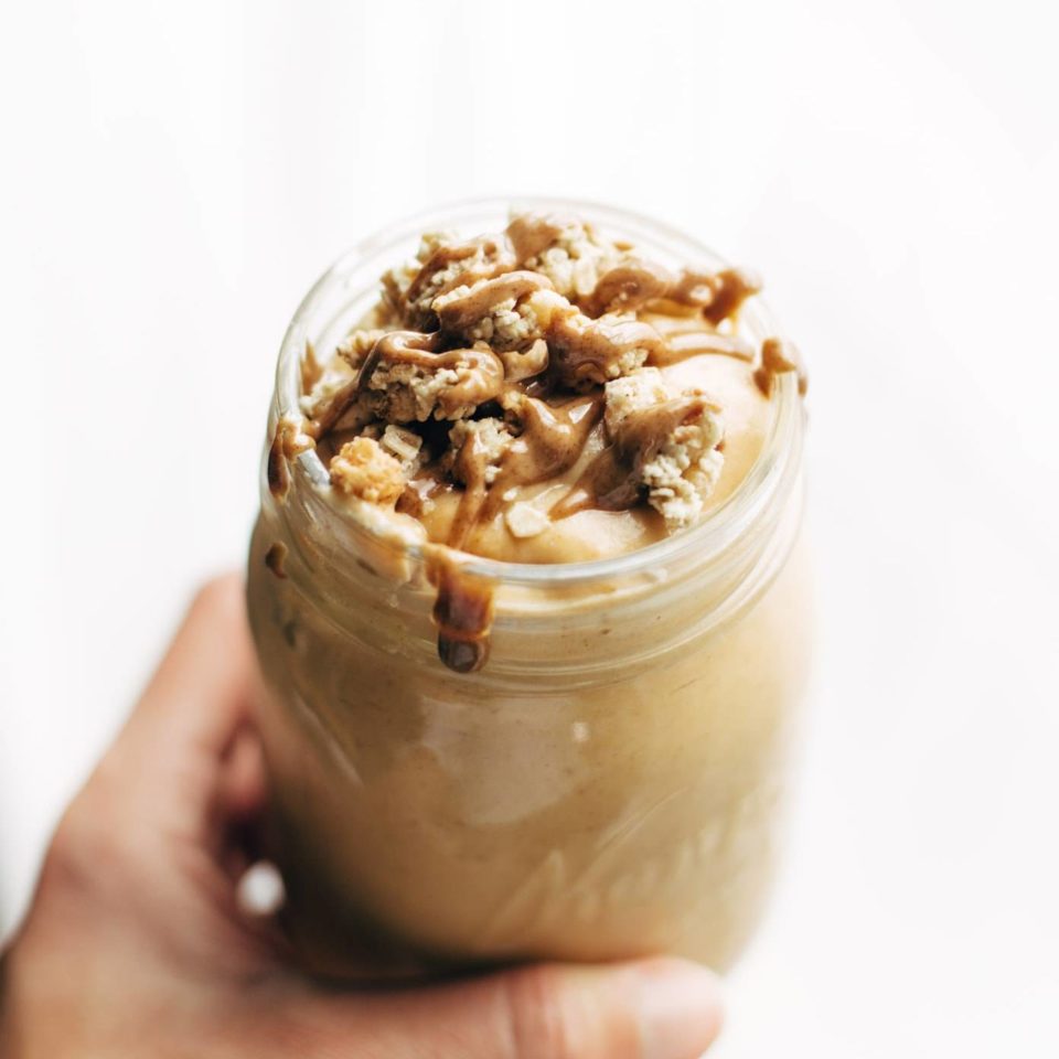 Autumn Glow Milkshake in jar with almond butter topping.