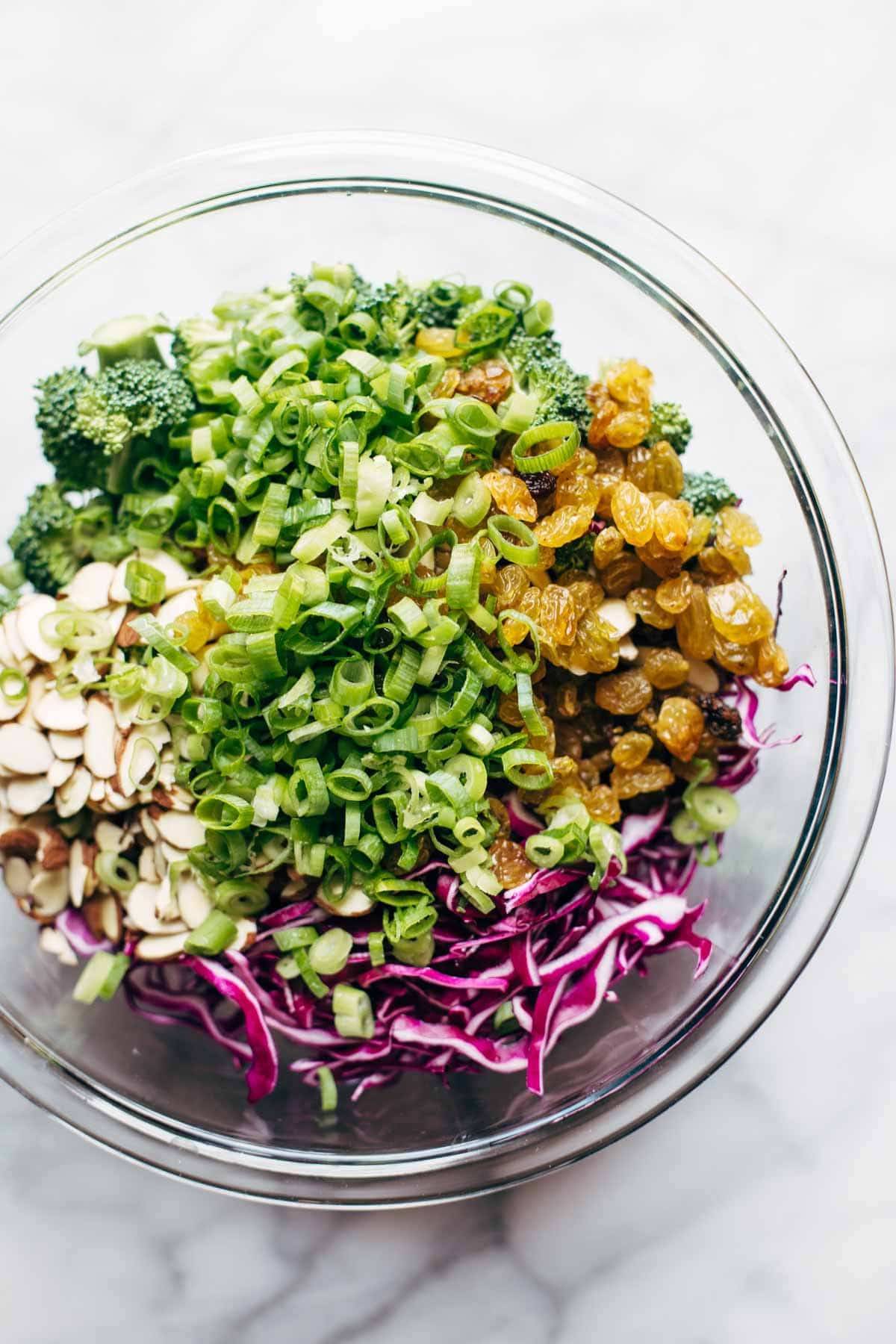 Broccoli salad ingredients in a bowl.