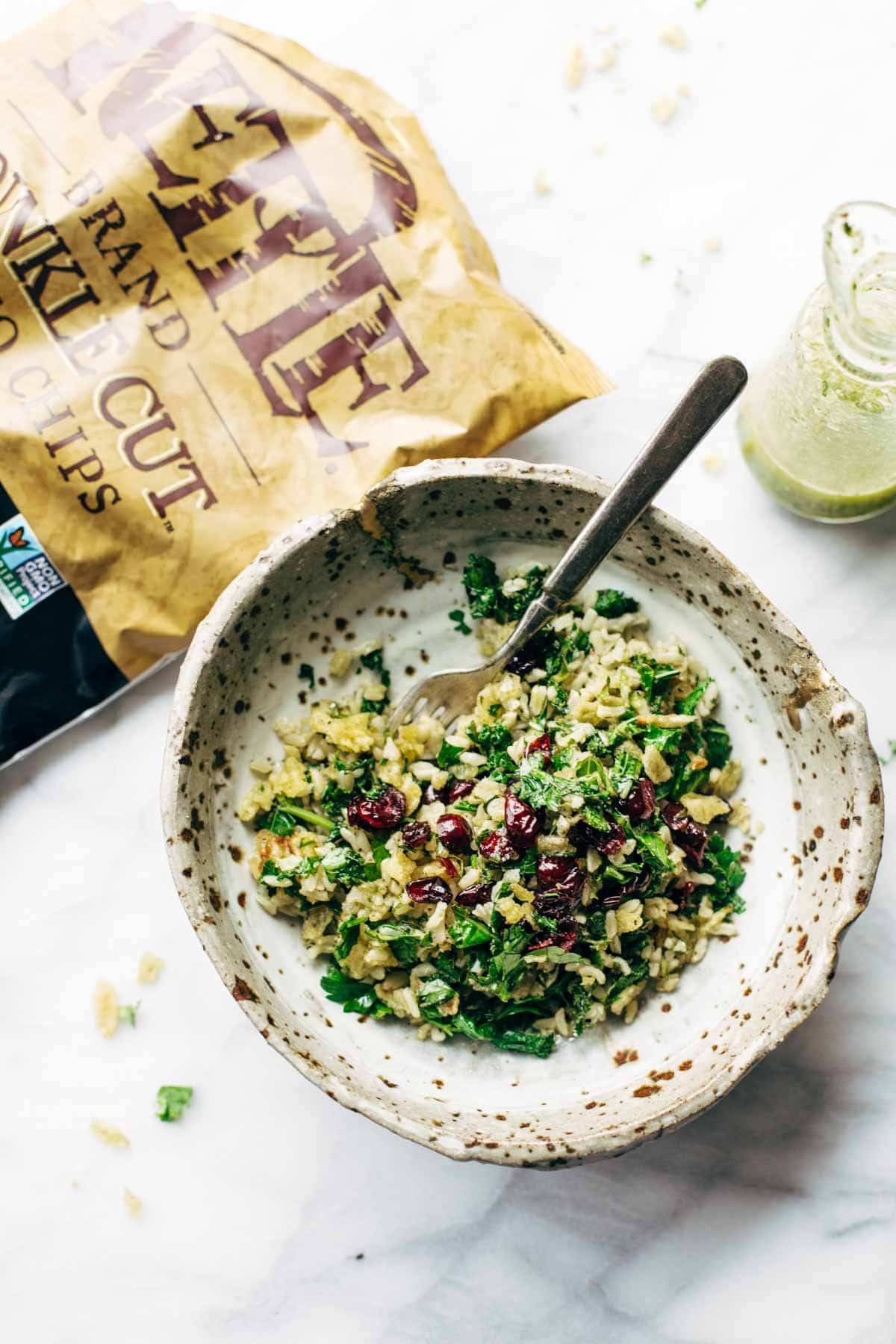 Garlic Kale and Brown Rice Salad with a zippy lemon herb dressing! This side dish recipe is so simple and it compliments almost any main dish! | pinchofyum.com