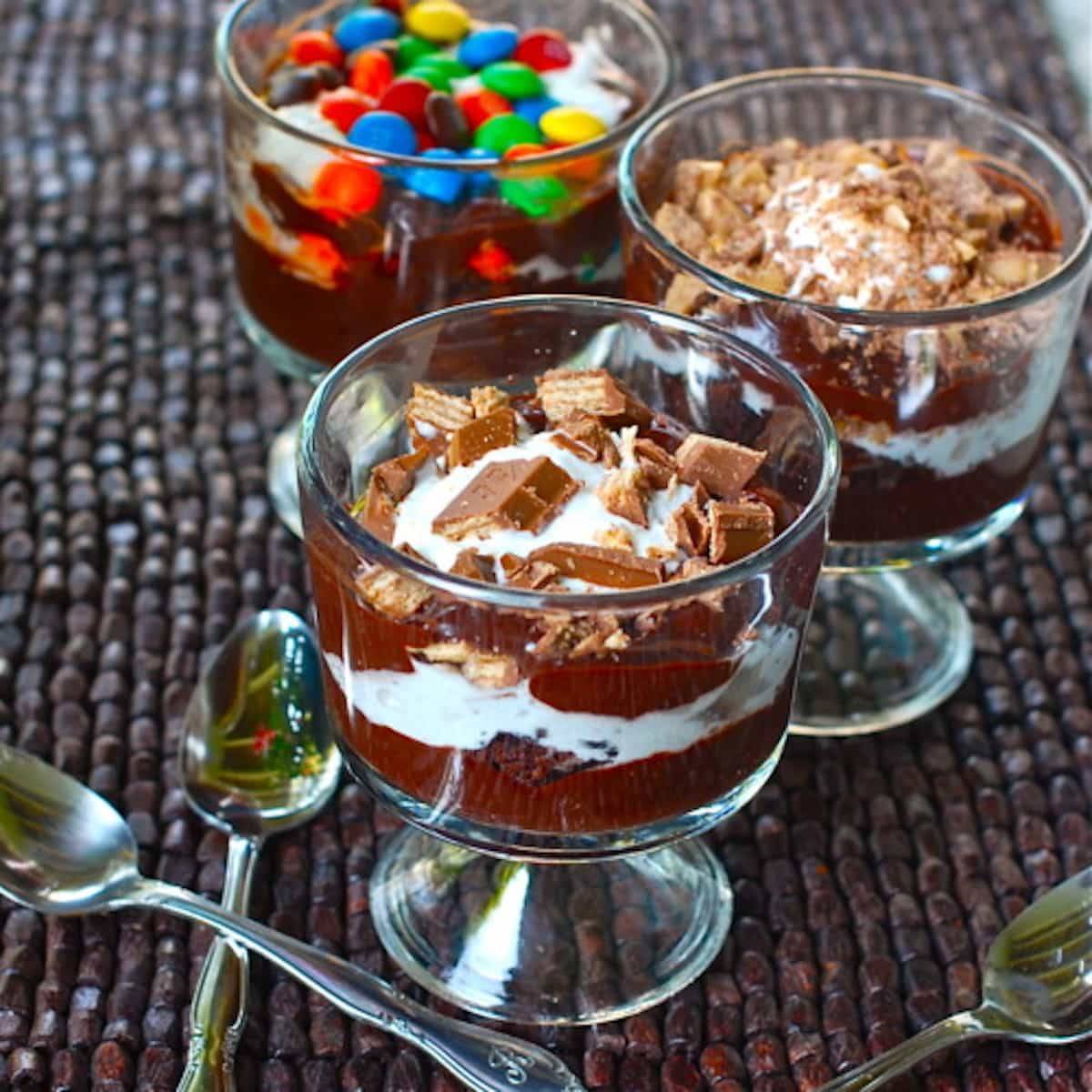Brownie fudge trifle with layers of gooey brownie, chocolate pudding, chocolate fudge, and whipped cream. Chocolate lover's dream! | pinchofyum.com