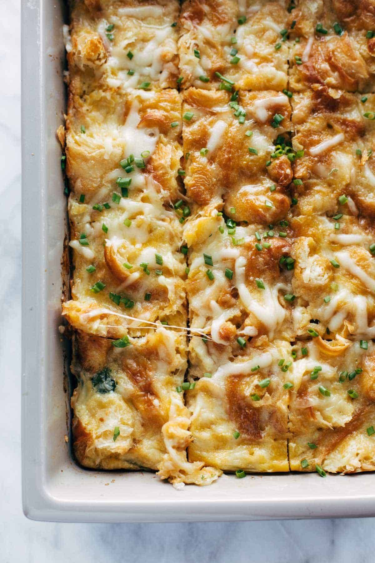 Egg and croissant brunch bake in pan.
