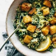 A picture of Brussels & Kale Caesar with Cheezy Garlic Croutons