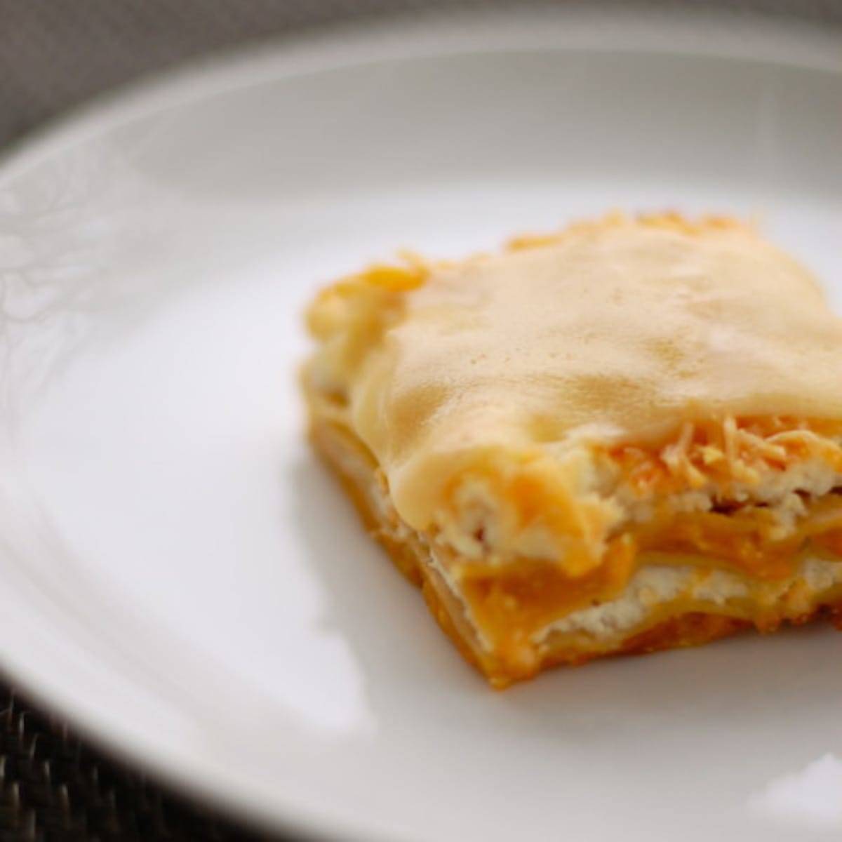 Butternut squash lasagna on a white plate.