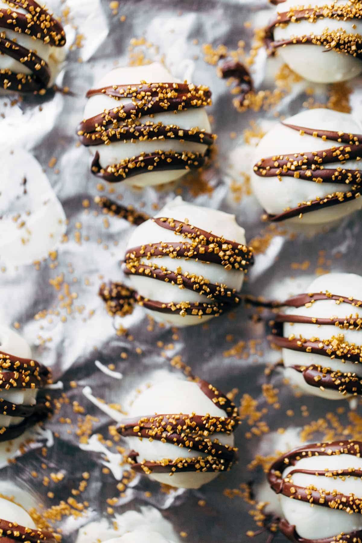 Minty Chocolate Cake Bites with chocolate drizzle and sprinkles