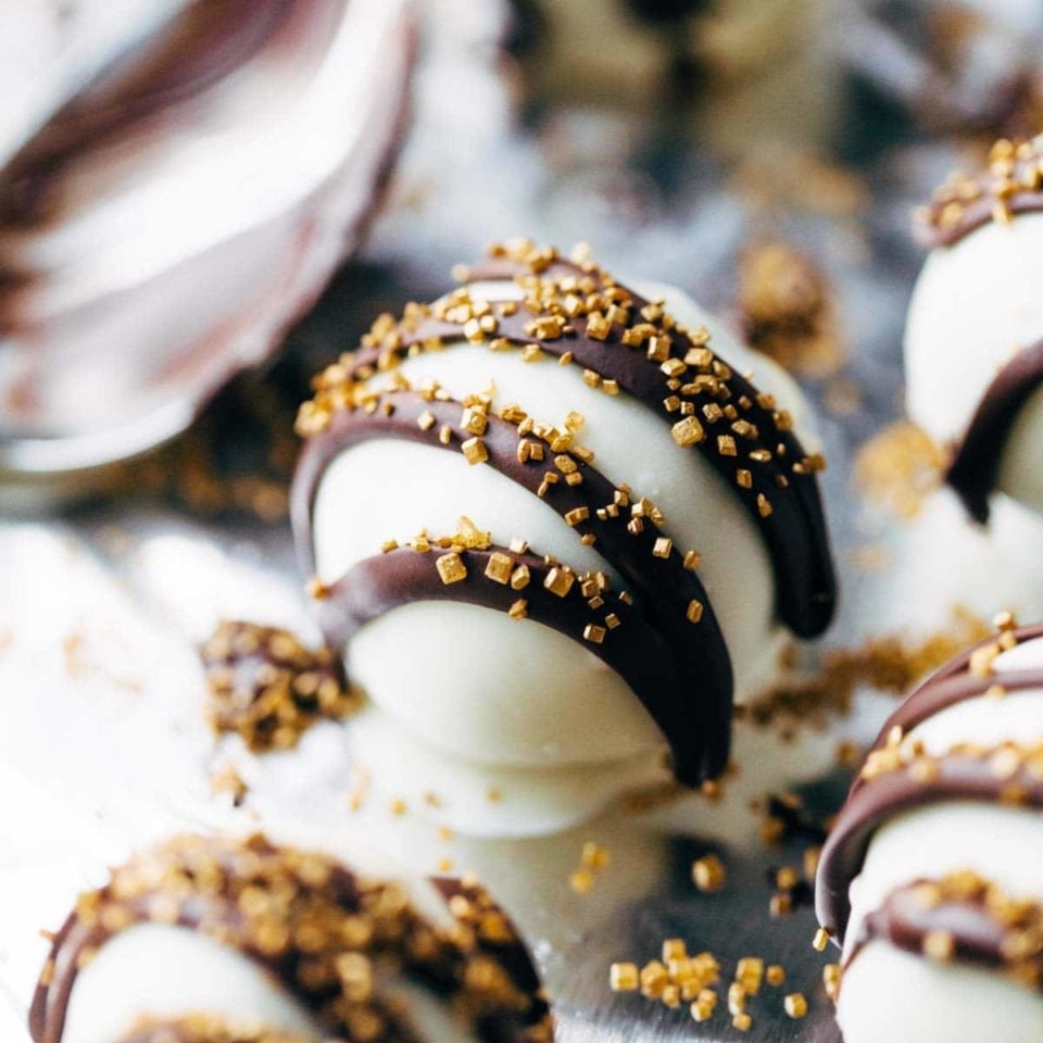 Minty Chocolate Cake Bites on pan with chocolate drizzle.