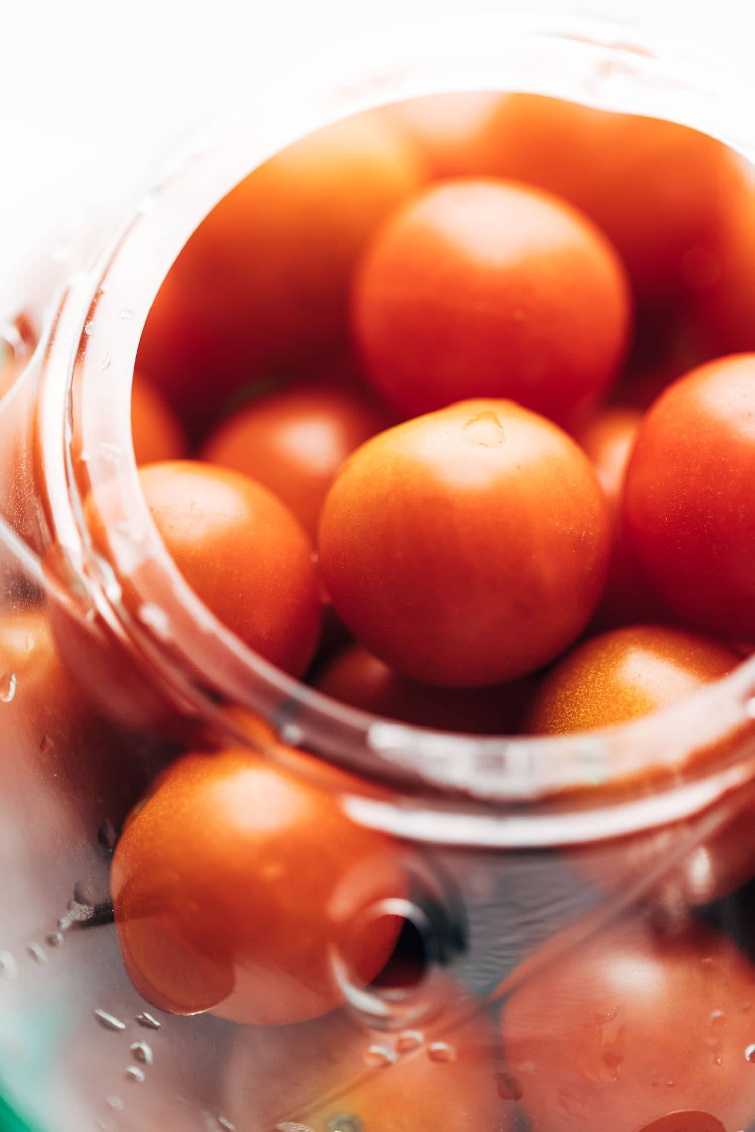 Tomatoes in a clear container.