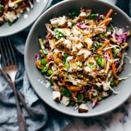 Cashew Crunch Salad in a bowl with dressing.