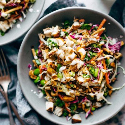 Cashew Crunch Salad in a bowl with dressing.