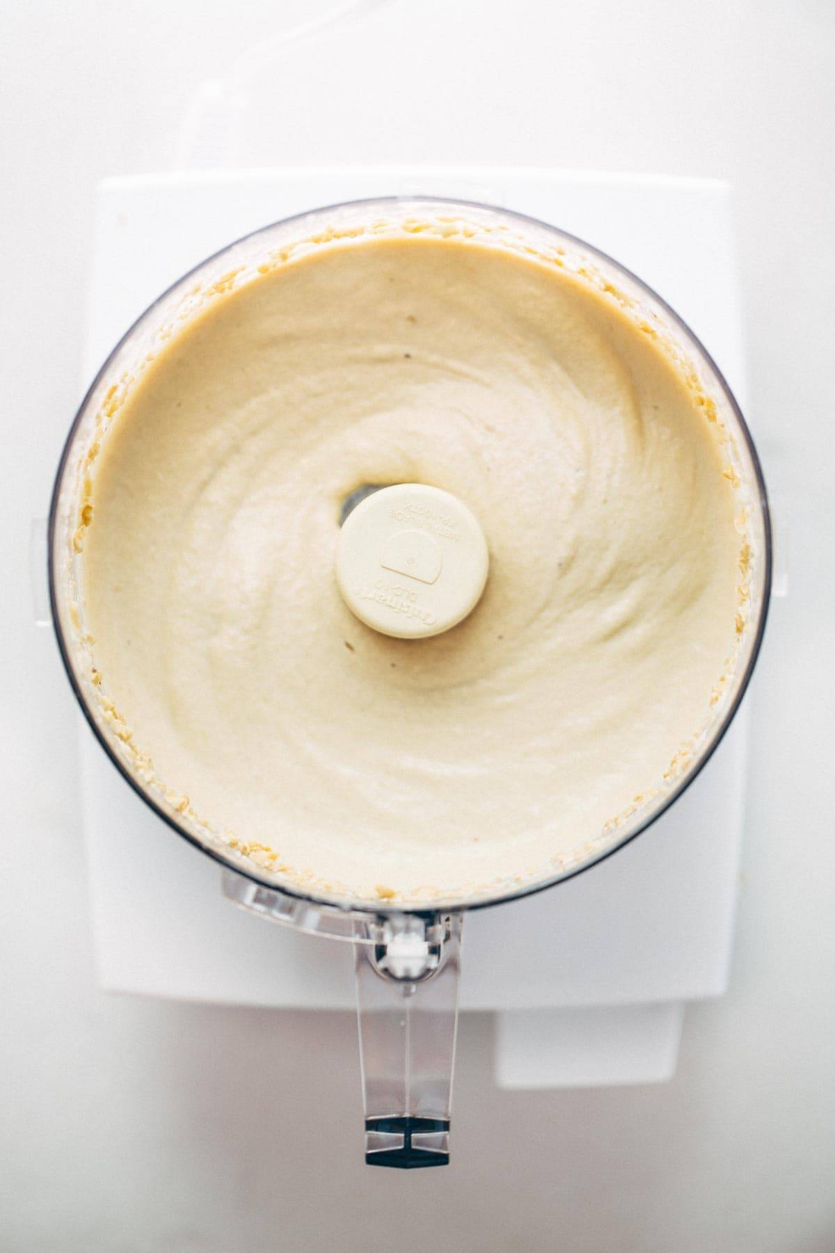 Cashew Sauce! Just four easy ingredients: cashews, garlic, salt, and water! Perfect base sauce recipe for pasta, dips, or cheesy sauce alternatives. Vegan. | pinchofyum.com