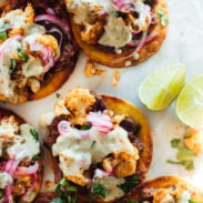 A picture of Cauliflower Black Bean Tostadas with Queso and Pickled Onion