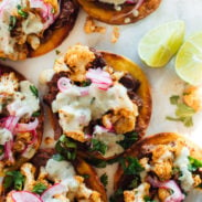 A picture of Cauliflower Black Bean Tostadas with Queso and Pickled Onion