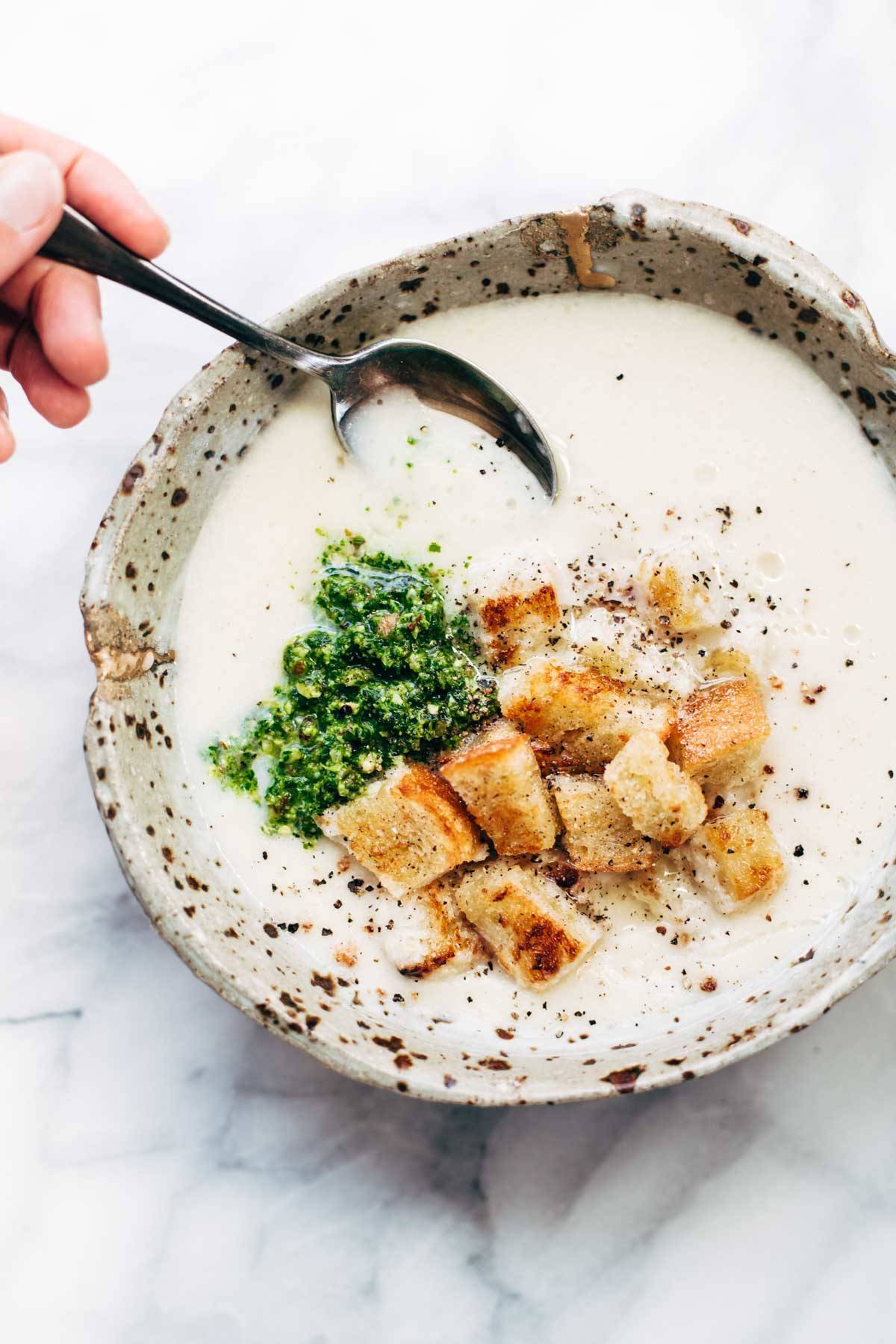 This 5 Ingredient Cheesy Cauliflower Soup is ultra creamy - and all you need is an onion, cauliflower, butter, broth, and cheese! SO EASY. | pinchofyum.com