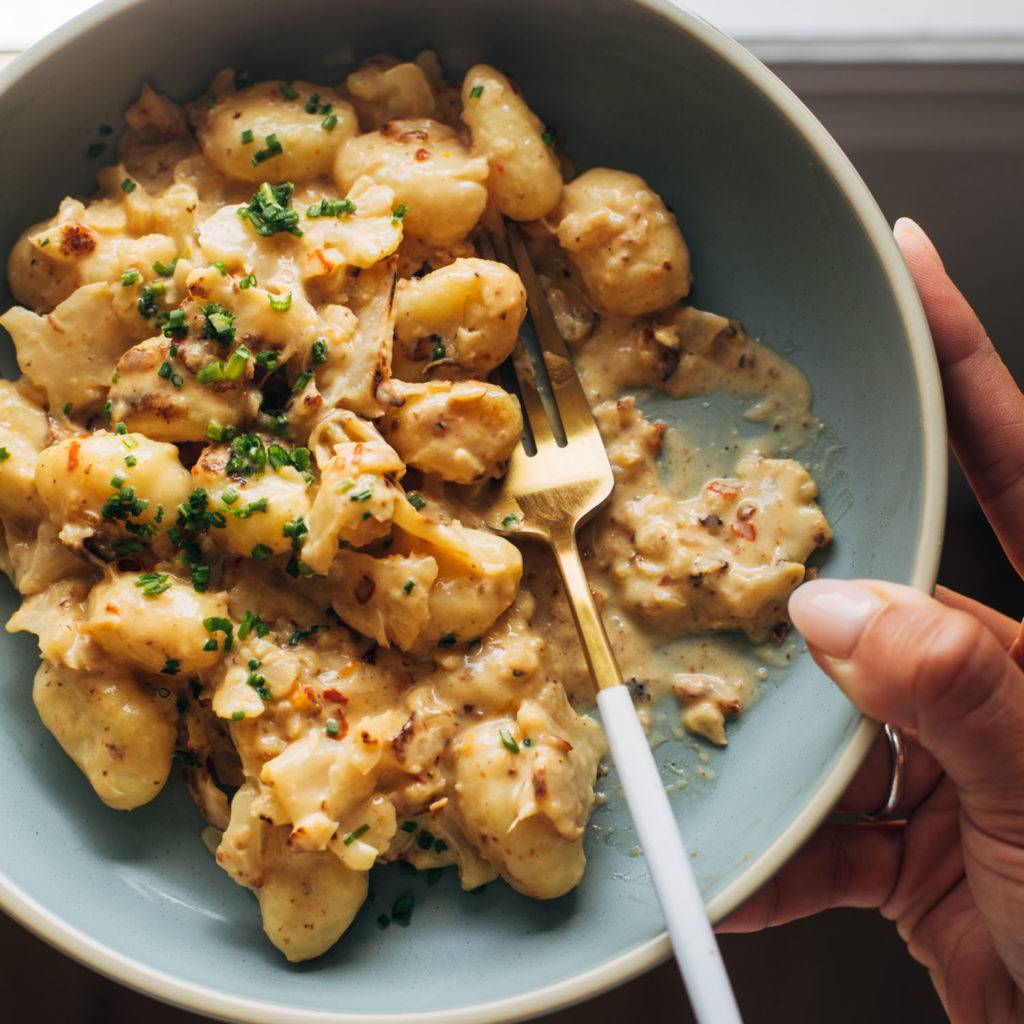 Gnocchi in a pasta bowl with a creamy sauce.