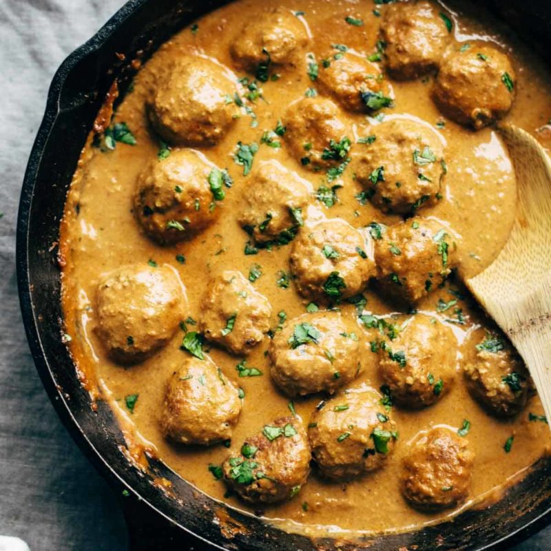 Vegetarian Meatballs in pan with spoon.