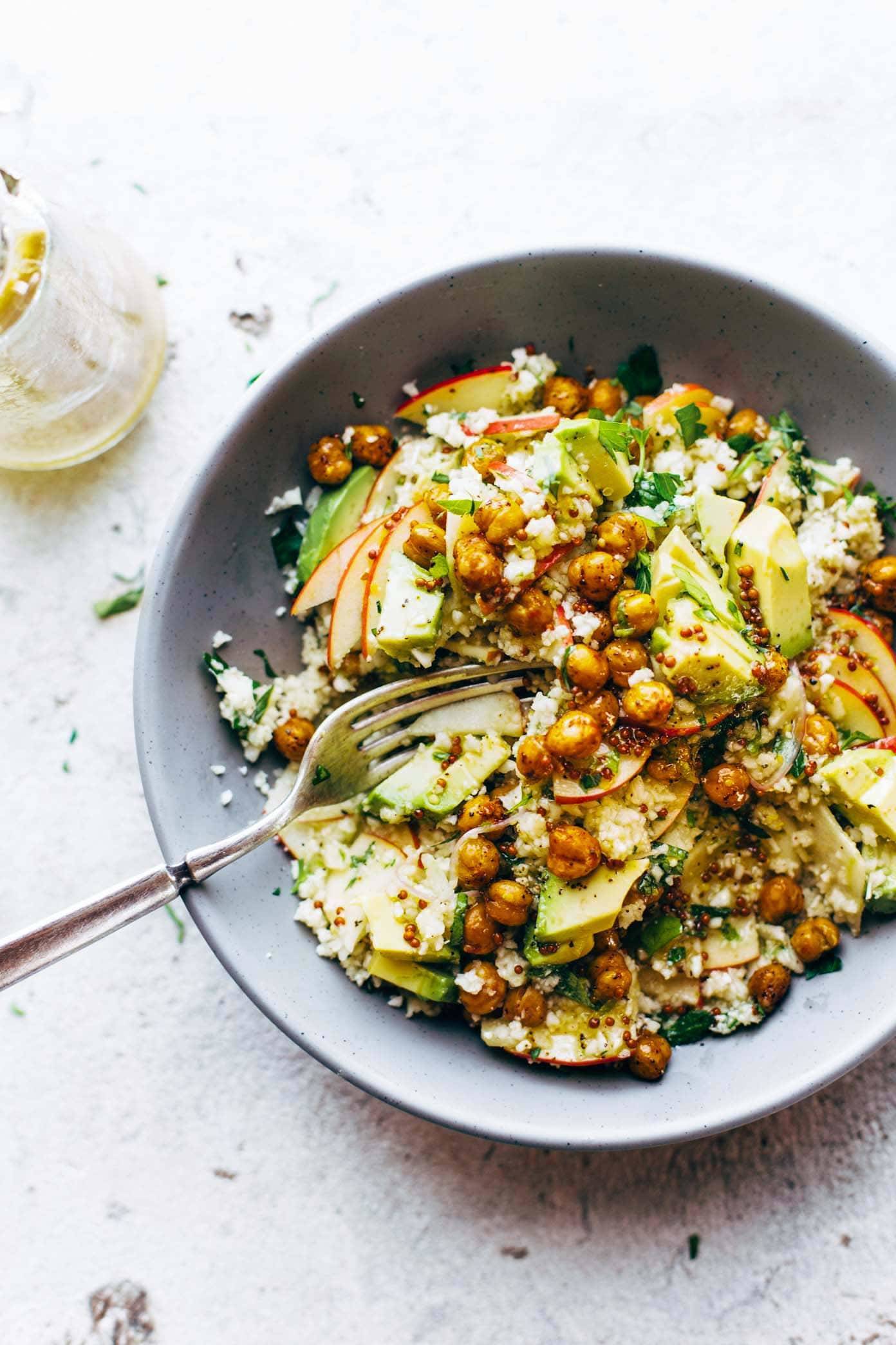 Spring Detox Cauliflower Salad in a bowl with a fork.
