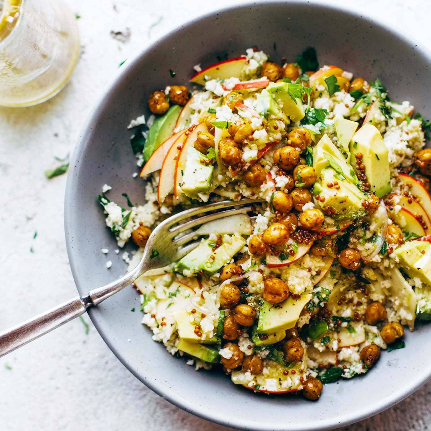 Detox Cauliflower Salad in bowl with fork.