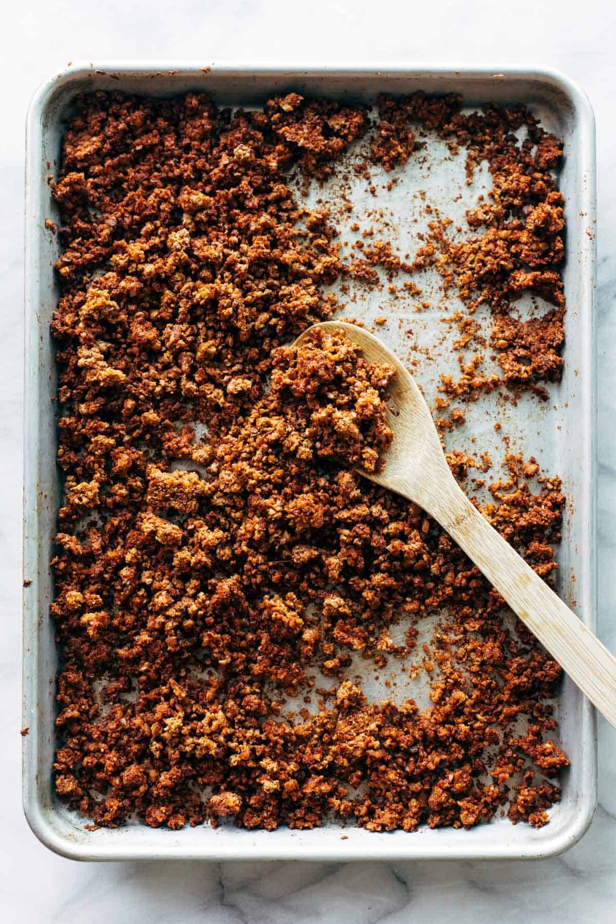 Cauliflower Walnut Taco Meat on a tray with a spoon in it.