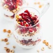 5 Minute Honey Yogurt Quinoa Parfait in a glass with a spoon.