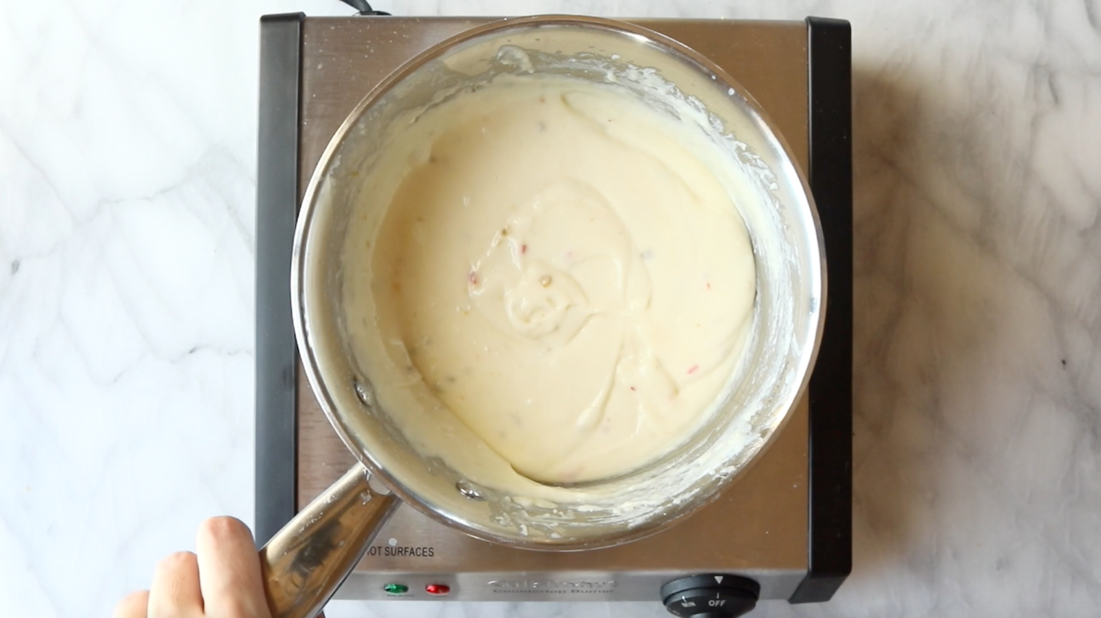 Cheese sauce in a pan.