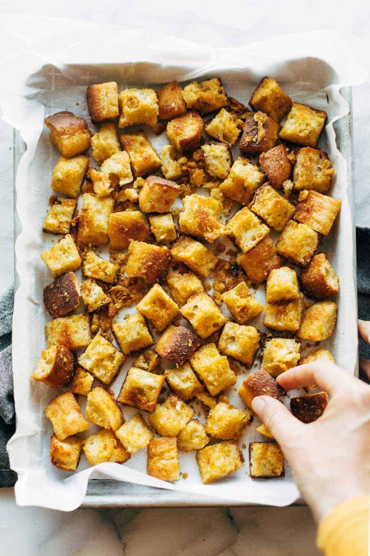 Cheezy Garlic Croutons on a sheet pan.