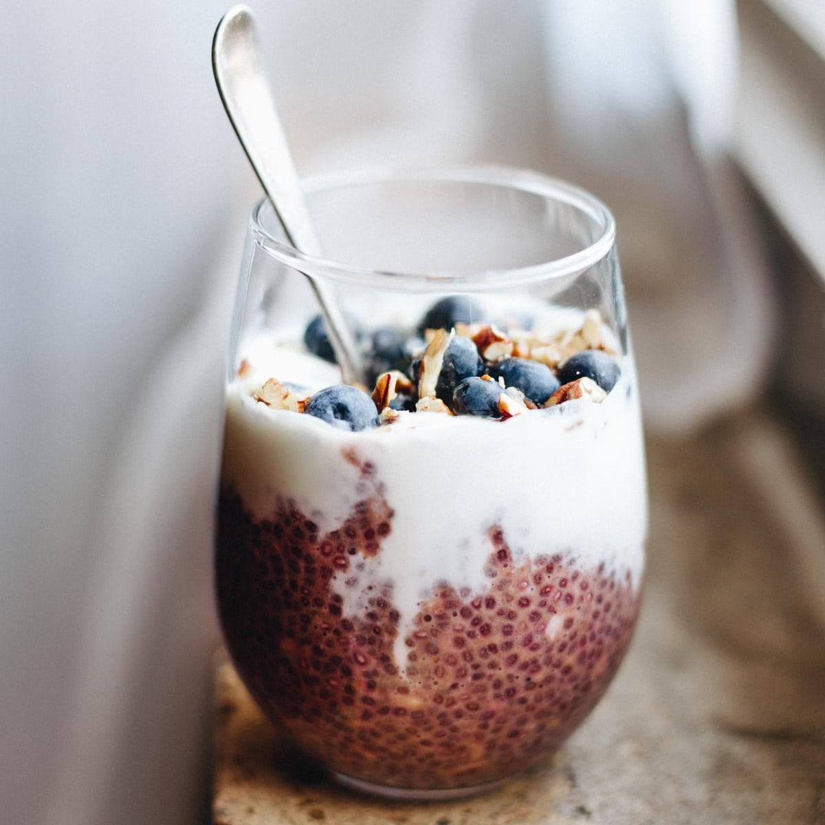 Chia oats with Yogurt and Berries in a glass.