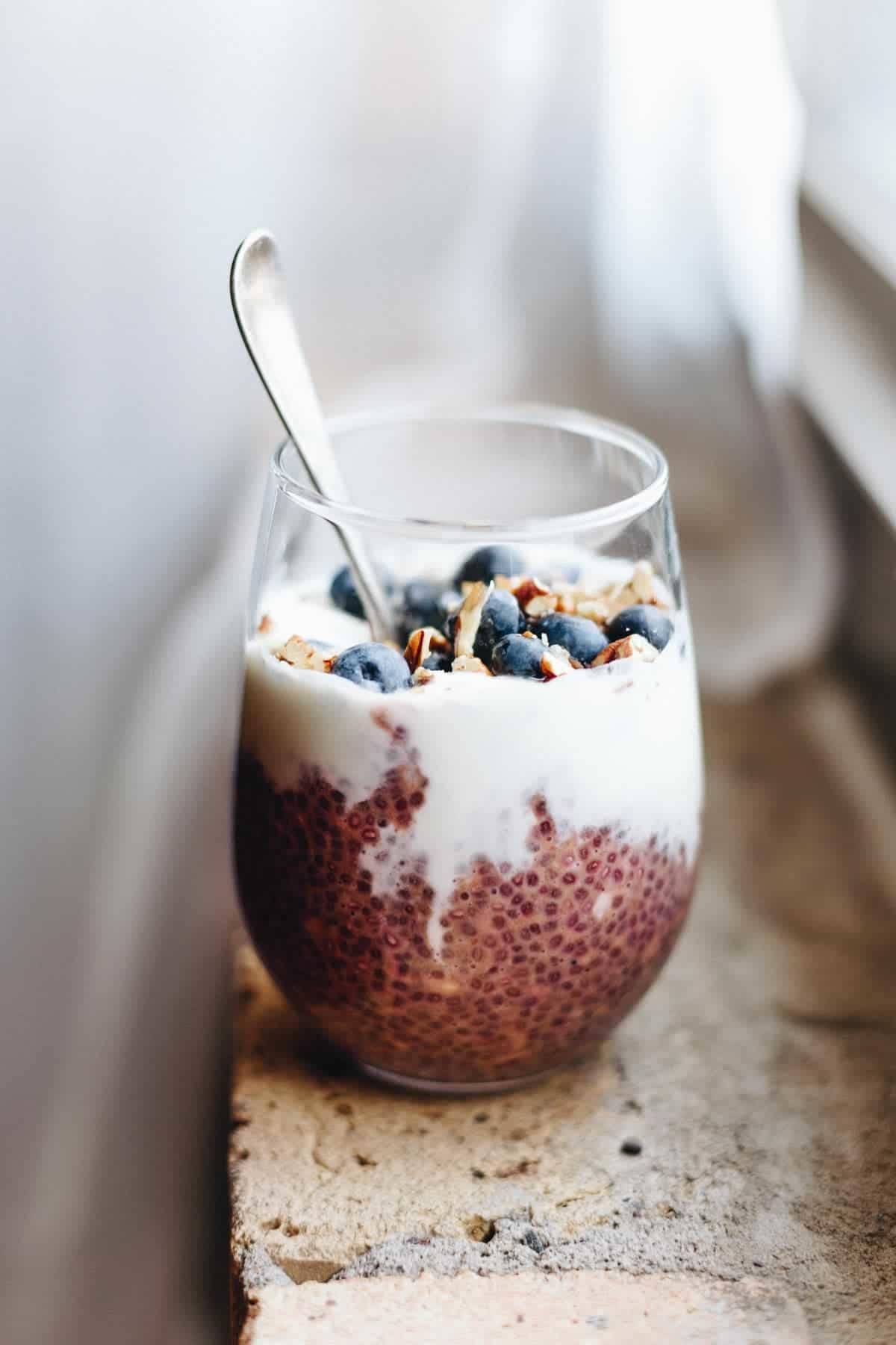 Chia overnight oats in a glass with a spoon.