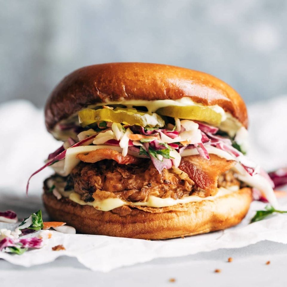 Fried chicken sandwich with slaw and pickles.