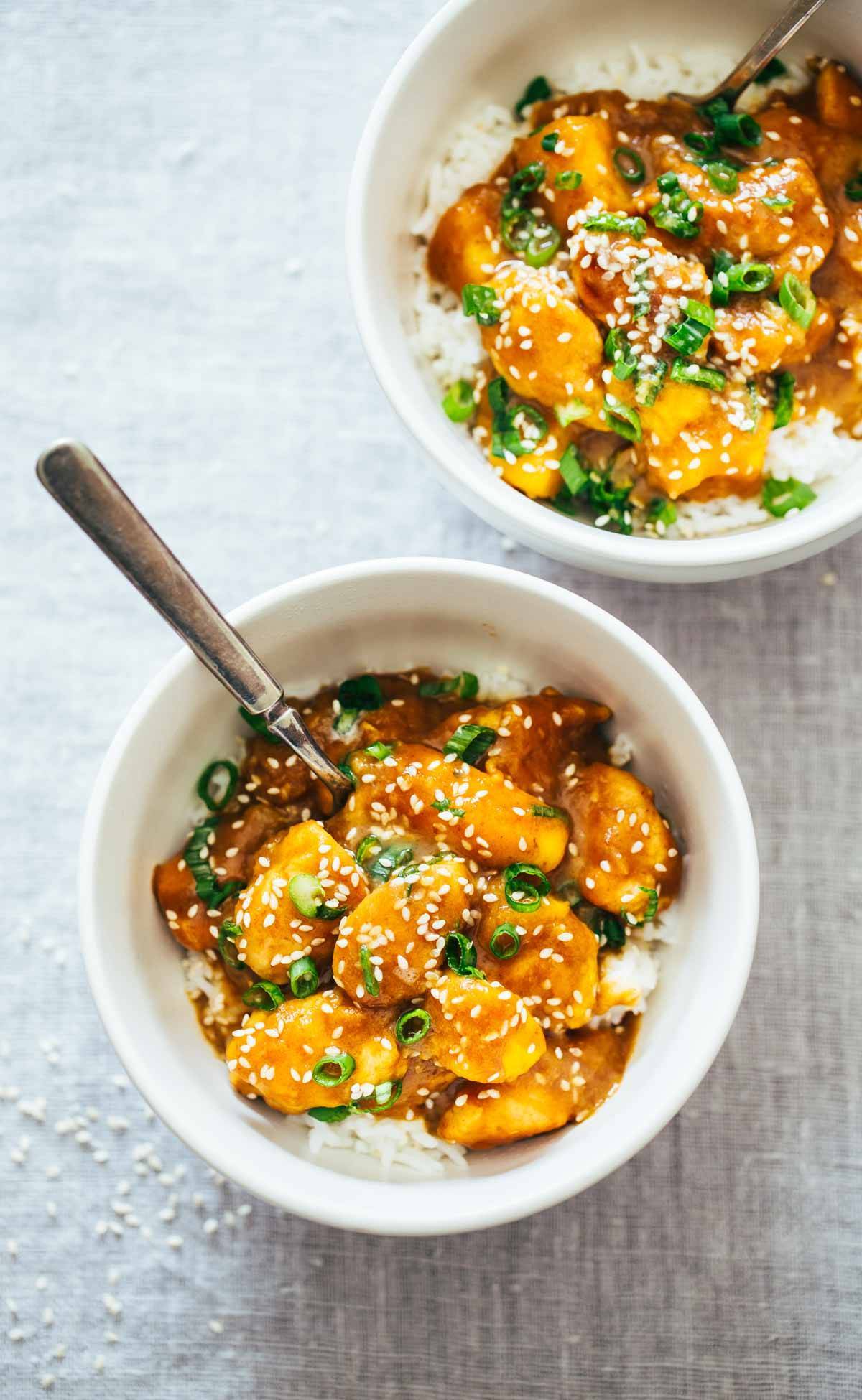 Sesame Mango Chicken Teriyaki in two bowls with rice.
