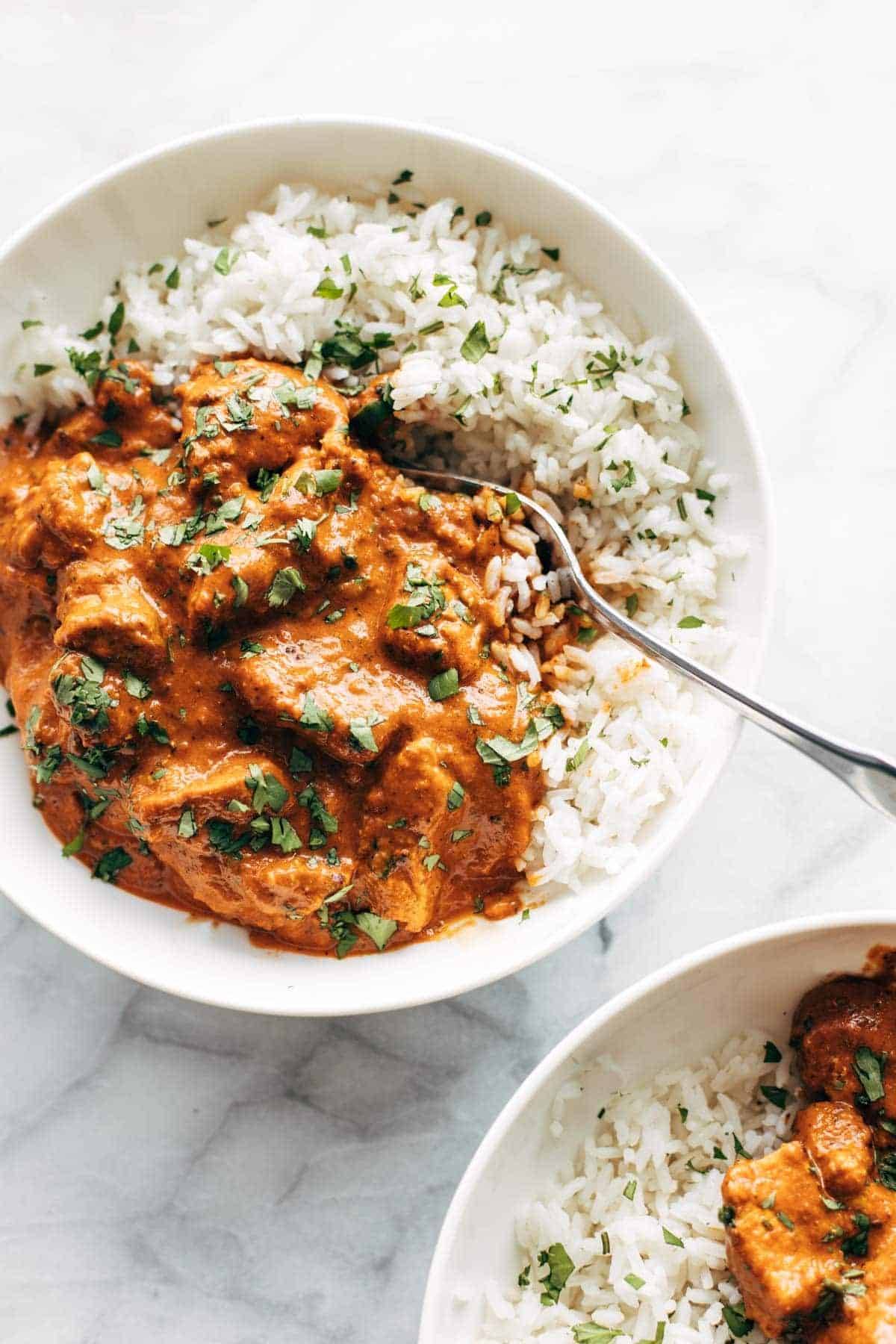 Chicken tikka masala in a bowl with rice.