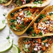 Tacos with chicken tinga and onion.