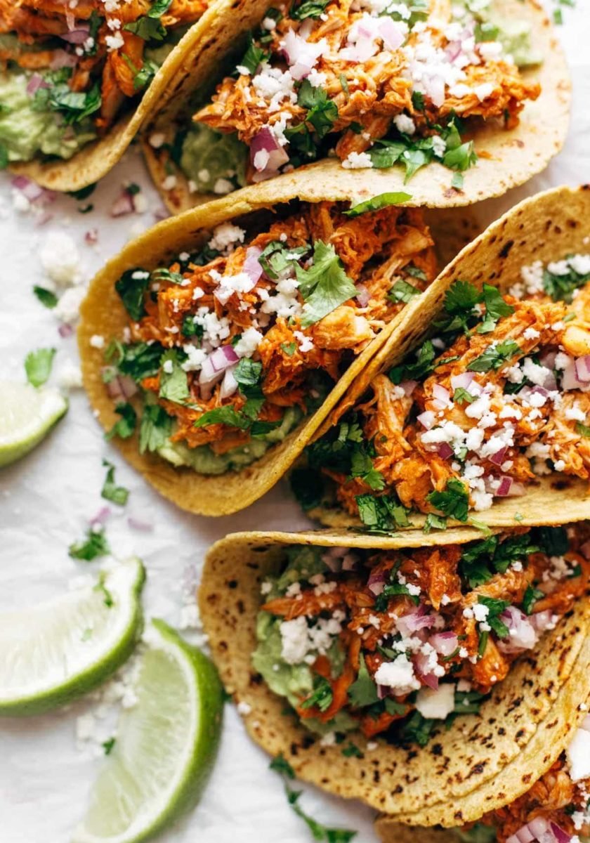 Tacos with chicken tinga and onion.
