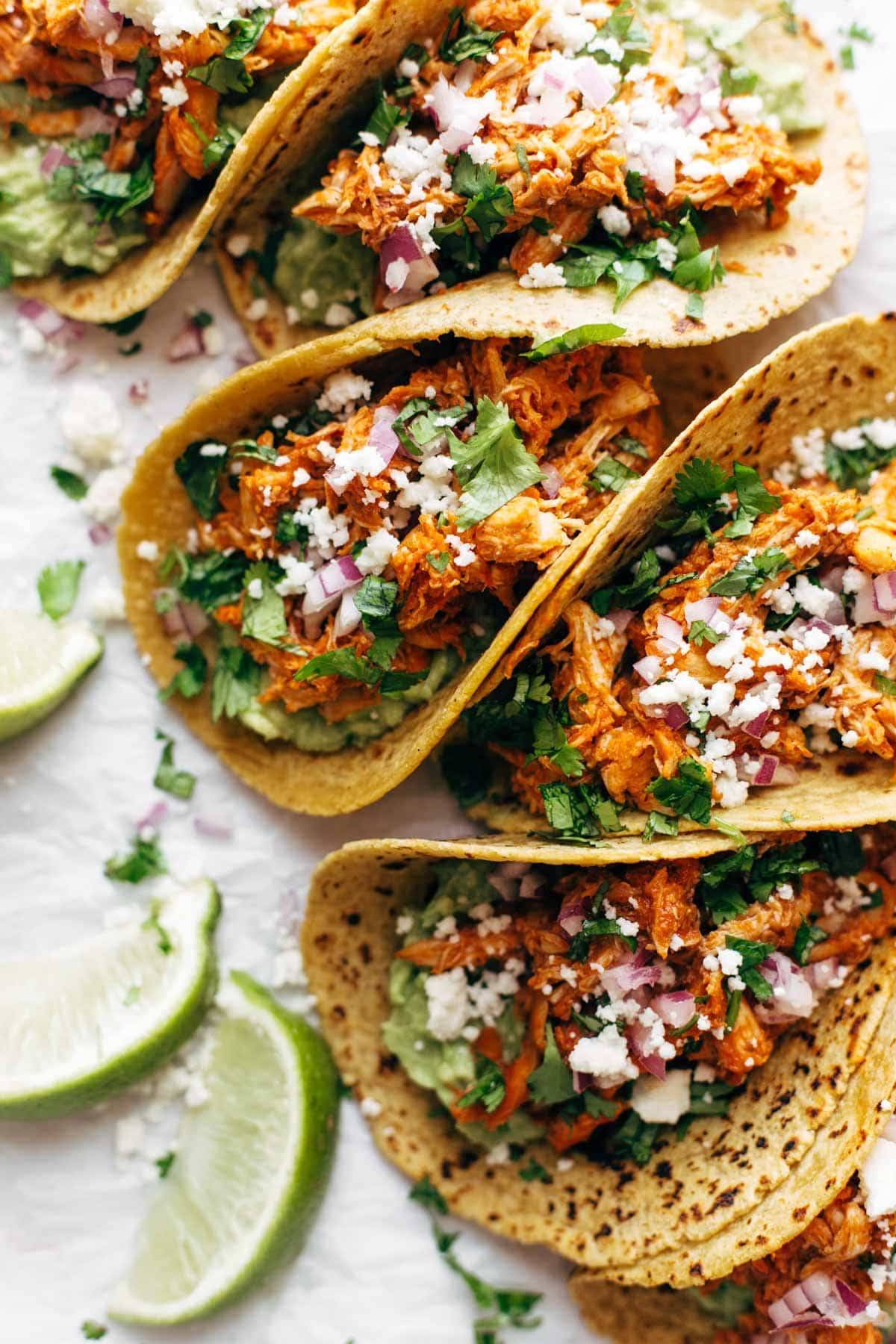 Tacos with chicken tinga and onion.