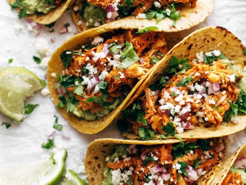 Chicken Tinga Tacos in a row.